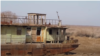 A rusting boat lies on the bed of what was once the Aral Sea. The increasing threat that this ecological disaster might be repeated in the Caspian Sea is just one of many environmental challenges facing Central Asia. (file photo)