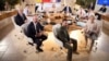 Ukrainian President Volodymyr Zelenskiy (foreground center) meets with G7 leaders at the group's summit in Italy in June. 