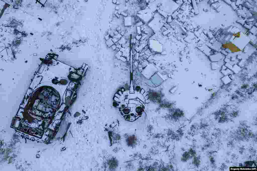 A destroyed Russian tank lies in the snow in the town of Svyatohyrsk on February 12, 2023.