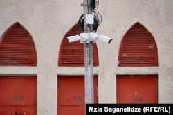 Hikvision surveillance cameras observe an intersection in Tbilisi.