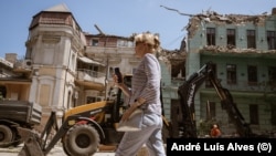 A woman walks past damaged historic buildings in the center of the Ukrainian city of Odesa, which UNESCO has listed as a World Heritage site. (file photo)