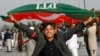 Supporters of Imran Khan's Pakistan Tehreek-e-Insaf (PTI) party block a highway as they protest against the election results in Peshawar on February 12.