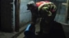 A Kyrgyz man clears water from a flooded house in Jalal-Abbad on April 21.
