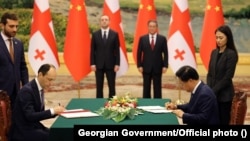 Georgian and Chinese officials sign a strategic partnership agreement in China in July 2023. 