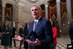 House Speaker Kevin McCarthy talks to reporters at the Capitol on September 26.