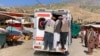 Relatives carry the bodies of slain victims in an ambulance after a bomb explosion at a mosque in Afghanistan's Badakhshan Province on June 8. 