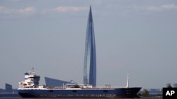 An oil tanker sails in the Finnish Gulf past the Lakhta Center skyscraper, the headquarters of Russian gas monopoly Gazprom in St. Petersburg.