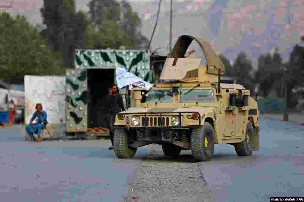 A Humvee is seen near the closed gates of the Torkham border crossing. Pakistan defended its decision to close its main border crossing with landlocked Afghanistan, saying Taliban authorities there were trying to build &quot;unlawful structures&quot; on its territory and &quot;resorted to indiscriminate firing&quot; when challenged. &nbsp;