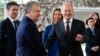 German Chancellor Olaf Scholz (right) shakes hands with Uzbek President Shavkat Mirziyoev upon the latter's arrival in Berlin on May 2. 