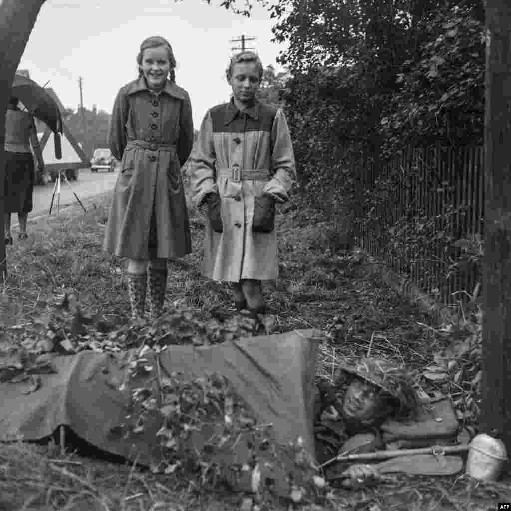 German girls watch a British soldier during the 1951 NATO exercise. The idea of a trans-Atlantic military alliance had been formed after World War II as the U.S.S.R. appeared poised to bully its way across an exhausted Europe. In 1948 the Kremlin backed a communist coup in Czechoslovakia, and began to pressure Norway into forming a &ldquo;non-aggression&rdquo; pact. &nbsp;