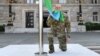 Azerbaijani President Ilham Aliyev raises the national flag of in Xankendi on October 15.