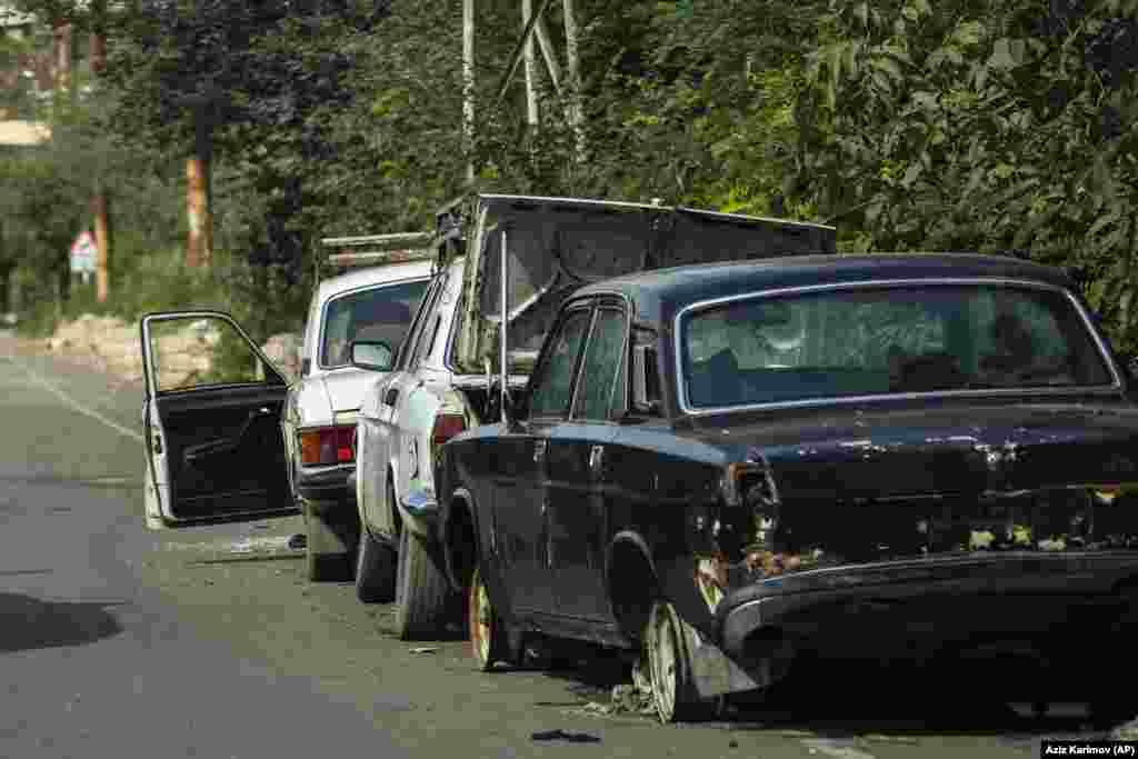 Abandoned cars line a deserted street in Xankendi. After six years of separatist fighting ended in 1994 following the collapse of the Soviet Union, Nagorno-Karabakh came under the control of ethnic Armenian forces, backed by Armenia, turning about 1 million of its Azerbaijani residents into refugees.