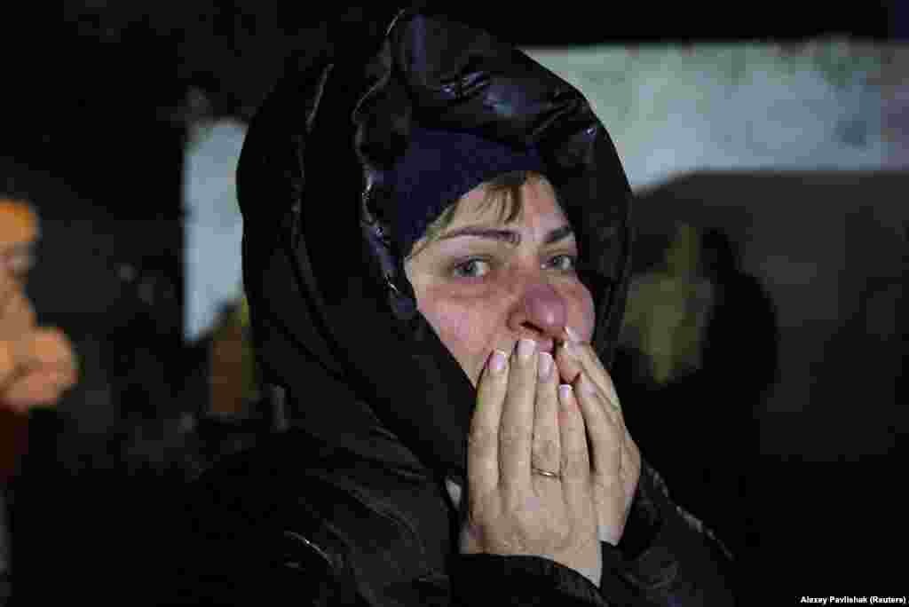 A woman reacts during the emergency evacuation.