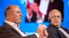 Mikhail Khodorkovsky (right) listens to a speaker at the 2024 Globsec international security forum in Prague on August 31.