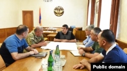 Karabakh President Arayik Harutiunian (center) held what appeared to be an emergency meeting with Defense Army commander Kamo Vartanian and other security officials.