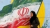 An Iranian cleric speaks to a crowd of protesters demonstrating in the city of Mashhad, in the Khorasan Razavi province, on August 3.