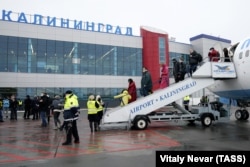 Passengers disembark a Boeing 737-800 plane operated by the Pobeda Airline at the Khrabrovo airport in Kaliningrad, Russia.