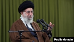 Iranian activists abroad have accused officials and Supreme Leader Ali Khamenei (pictured on April 16 in Tehran) of colluding "against the people."