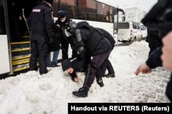 A person is forcibly detained during an anti-war protest in Yekaterinburg on March 6.