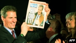 Republican Scott Brown displays a special edition of the "Boston Herald" after winning the Massachusetts Senate seat.