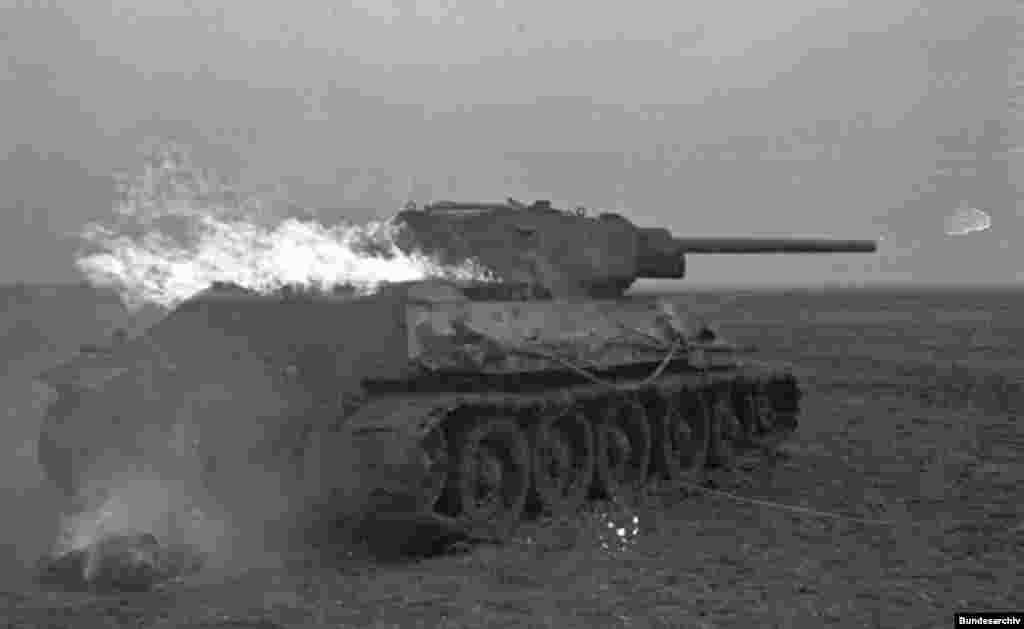 A T-34 on fire, after Nazi Germany&#39;s invasion of the Soviet Union in 1941.