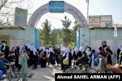 Girls leave their school following the Taliban's order of closure just hours after schools had reopened in Kabul on March 23.