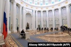 Russian President Vladimir Putin chairs a meeting of the Security Council in Moscow on February 21, just a few days before the invasion of Ukraine.