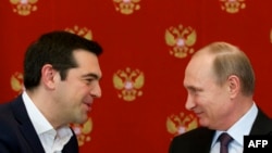 Russian President Vladimir Putin (right) has led a conspicuous effort to highlight tensions between Brussels and Athens, led by Prime Minister Alexis Tsipras. 