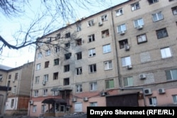 An apartment building was among the extensive damage of Russian shelling in Kherson on December 28.