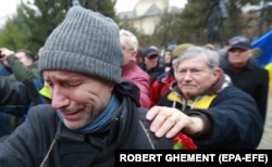 Romanians commemorate the 33rd anniversary of the 1989 anti-communist revolution, in Bucharest on December 21, 2022.