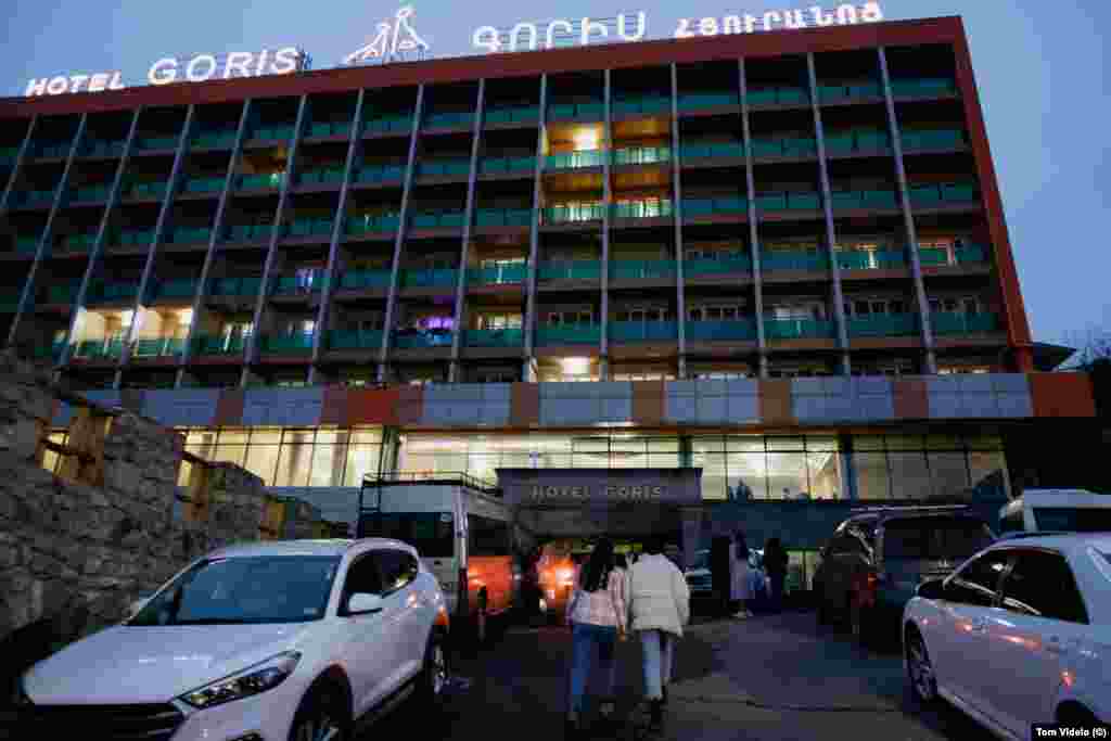 People walk into the Hotel Goris. The Armenian town has become a base for many of the approximate 1,100 Karabakh locals who have been stranded since a blockade of Nagorno-Karabakh began on December 12, cutting off the flow of people and supplies, including medicines and food, from the breakaway region.