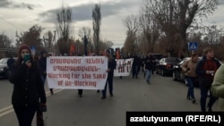 Armenian protesters march near the Russian military base in Gyumri on January 8.