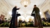 U.S. President Joe Biden (left) and Ukrainian President Volodymyr Zelenskiy hold a joint news conference in the East Room of the White House in Washington on December 21.