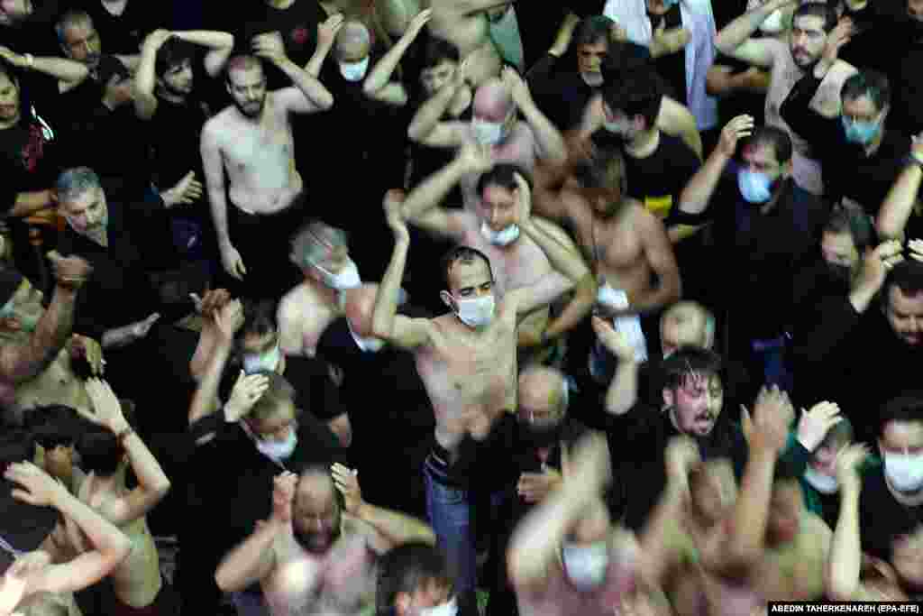 Mourners hit themselves during the Ashura ceremonies at the Kerbala mosque in Tehran.&nbsp;Iranian health experts worried that large crowds could spark another surge in infections.