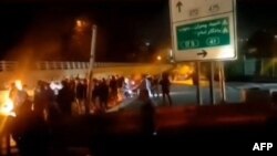 A video posted on social media on October 15 purportedly shows Iranian protesters gathered on a road leading to Evin prison, northwest of Tehran, where a fire broke out over the weekend amid reports of an uprising.