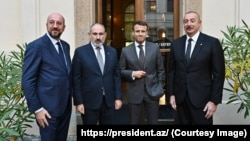 European Council President Charles Michel, Armenian Prime Minister Nikol Pashinian, French President Emmanuel Macron, and Azerbaijan President Ilham Aliyev meet in Prague on October 6, 2022. Days later, Macron gave an interview that set off an anti-France campaign in Azerbaijan after he called the 2020 conflict "a terrible war." 