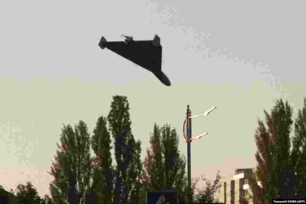 An AFP photographer captured a Russian-launched, Iranian-built suicide drone shortly before impact in Kyiv on October 17. The Iranian-made Shahed 136, which Russia has rebranded as the Geran-2 drone, packs an explosive charge and can linger over targets before nosediving into them. Their distinctive delta-shaped wing make them readily identifiable.