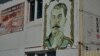 Russia - A woman carries the portrait of Josef Stalin during the pro-Communist demonstration in Moscow, 01May2007