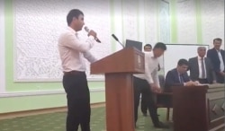 Tajik state TV shows footage of students publicly announcing they want to join the army.