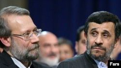 Parliament speaker Ali Larijani (left) and President Mahmud Ahmadinejad at a gathering of the parliament and cabinet in February