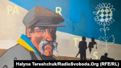 A painting features in an exhibit titled "Kherson Is Ukraine" in Lviv on October 14. Along with the three other regions that Russia claims, Kherson is now under martial law -- according to Putin. 