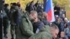 Russian conscripts say goodbye to relatives at a recruiting office in Moscow in early October.