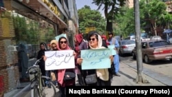 Afghan women protest against the Taliban decree on enforcing compulsory face coverings for women in public.