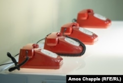 Telephones that a guide says were direct lines to governments of the republics of Yugoslavia.