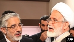 Presidential candidates Mir Hossein Musavi (left) and Mehdi Karrubi have refused to back down in their calls for a new election.