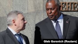 U.S. Defense Secretary Lloyd Austin (right) and Ukrainian Defense Minister Andriy Taran in Kyiv on October 19.