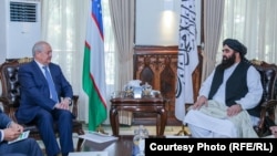 Uzbek Foreign Minister Abdulaziz Kamilov met with acting Foreign Minister Amir Khan Muttaqi in Kabul on October 7.