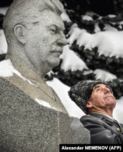 A Soviet Army veteran stands next to the tomb of Soviet dictator Josef Stalin during a memorial ceremony to mark his birth in Red Square in Moscow in 2020.