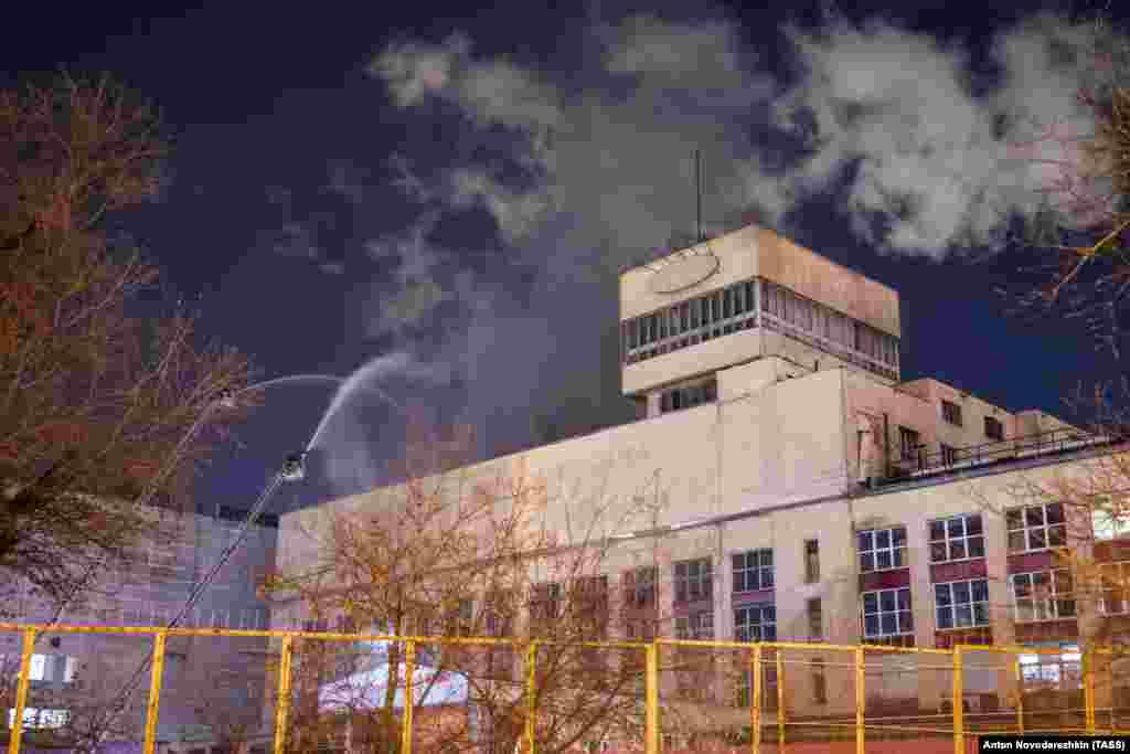 December 2: Firefighters hose down the roof of a meat-processing plant in Moscow. More than 100 firefighters were needed to extinguish the blaze. Twelve people were evacuated from the building and no one was injured.&nbsp;