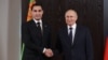 Turkmen President Serdar Berdymukhammedov (left) and Russian President Vladimir Putin shake hands during a meeting on the sidelines of the Shanghai Cooperation Organization in Samarkand, Uzbekistan, on September 15.